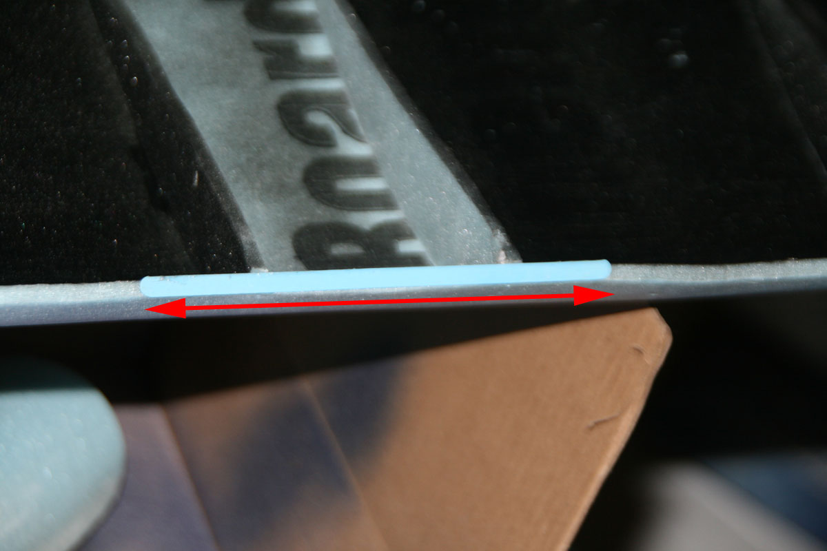 A coffee stir, glued to the leading and trailing edges of the wing, protects the foam from the rubber bands