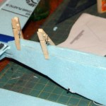 Gluing the lower fuselage cover in place.
